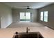 Spacious Gathering room with sliding glass doors leading to backyard at 13116 Shumard Way, Riverview, FL 33579