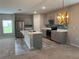 Modern kitchen with gray cabinets and island at 13116 Shumard Way, Riverview, FL 33579