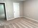 Spacious bedroom with carpeted floor and door to another room at 13116 Shumard Way, Riverview, FL 33579