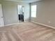 Bright bedroom with ensuite bathroom access and window at 13116 Shumard Way, Riverview, FL 33579