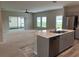 Open concept kitchen with island, stainless steel appliances, and views to Gathering room at 13116 Shumard Way, Riverview, FL 33579