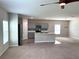 Open concept Gathering room with kitchen and neutral decor at 13116 Shumard Way, Riverview, FL 33579
