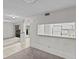 Small kitchenette with white appliances and pass-through counter at 300 S Florida Ave # 500C, Tarpon Springs, FL 34689