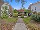Attractive building exterior with landscaping and walkway at 300 S Florida Ave # 500C, Tarpon Springs, FL 34689