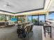 Living room with water view, comfy seating, and balcony access at 300 S Florida Ave # 500C, Tarpon Springs, FL 34689