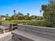 Wooden boardwalk with benches and tranquil waterfront views at 300 S Florida Ave # 500C, Tarpon Springs, FL 34689