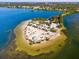 Aerial view of a secluded beach with a gazebo and volleyball court at 300 S Florida Ave # 500C, Tarpon Springs, FL 34689