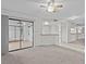 Bright living room with sliding glass doors leading to the patio at 300 S Florida Ave # 500C, Tarpon Springs, FL 34689
