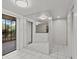 Large entryway with mirrored wall and access to the patio at 300 S Florida Ave # 500C, Tarpon Springs, FL 34689