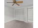 Bedroom with ceiling fan and large closet at 300 S Florida Ave # 500C, Tarpon Springs, FL 34689