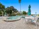 Inviting pool area with plenty of seating and umbrellas at 300 S Florida Ave # 500C, Tarpon Springs, FL 34689