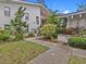 Building exterior with lush landscaping and walkway at 300 S Florida Ave # 500C, Tarpon Springs, FL 34689
