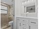 Updated bathroom with walk-in shower and modern vanity at 300 S Florida Ave # 500C, Tarpon Springs, FL 34689