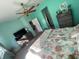 Main bedroom with a king-size bed and TV at 11413 Captiva Kay Dr, Riverview, FL 33569