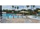 Community pool with a kiddie pool and shaded seating at 11413 Captiva Kay Dr, Riverview, FL 33569