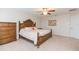 Comfortable bedroom with wood furniture and carpeted floors at 11818 Lake Blvd, New Port Richey, FL 34655