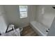 Clean bathroom with bathtub and granite countertop at 8518 N Edison Ave, Tampa, FL 33604