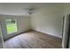 Spacious bedroom with laminate floors and large window at 8518 N Edison Ave, Tampa, FL 33604