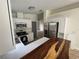 Modern kitchen with white cabinets and a wood countertop at 8518 N Edison Ave, Tampa, FL 33604