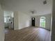 Bright living room with laminate floors and kitchen view at 8518 N Edison Ave, Tampa, FL 33604