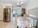 View of the dining area and kitchen showcases the home's open floor plan and inviting decor at 7809 39Th N Ave, St Petersburg, FL 33709