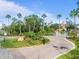 Gated community entrance with lush landscaping and signage at 5000 Culbreath Key Way # 8-120, Tampa, FL 33611