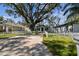 Property view showcasing the house and a white picket fence at 6824 N Sterling Ave, Tampa, FL 33614