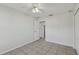 Spacious bedroom with tile floors and ceiling fan at 6824 N Sterling Ave, Tampa, FL 33614