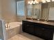 Bathroom with granite countertop, double sinks and shower at 13240 Satin Lily Dr, Riverview, FL 33579