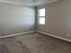 Spacious bedroom with carpeted floor and large window at 13240 Satin Lily Dr, Riverview, FL 33579