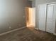 Spacious bedroom with neutral walls and carpet flooring at 13240 Satin Lily Dr, Riverview, FL 33579