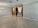 Open living room with tile floors and kitchen view at 13240 Satin Lily Dr, Riverview, FL 33579
