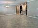 Open living room with tile floors and kitchen view at 13240 Satin Lily Dr, Riverview, FL 33579