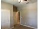 Bedroom with carpet, door to bathroom, and ceiling fan at 13240 Satin Lily Dr, Riverview, FL 33579