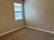 Simple bedroom with neutral walls and carpet flooring at 13240 Satin Lily Dr, Riverview, FL 33579