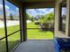 Screened patio overlooking backyard at 13240 Satin Lily Dr, Riverview, FL 33579