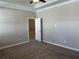 Bright bedroom with door to another room and ceiling fan at 13240 Satin Lily Dr, Riverview, FL 33579