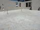 A concrete basement shows plumbing and framing, presenting a solid, modern foundation for customization at 559 W Davis Blvd, Tampa, FL 33606