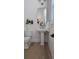 Elegant powder room with pedestal sink, modern fixtures, and sophisticated decor at 559 W Davis Blvd, Tampa, FL 33606
