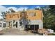 Construction of a two-story home featuring concrete blocks and exposed wooden framing at 559 W Davis Blvd, Tampa, FL 33606