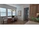 Cozy dining area with modern table and chairs, complemented by natural light from large windows at 559 W Davis Blvd, Tampa, FL 33606