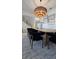 This dining room features a wooden table, soft black chairs, and an interesting chandelier at 559 W Davis Blvd, Tampa, FL 33606