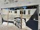 Interior view showcases concrete construction, framed windows, and staircase with view of the neighborhood at 559 W Davis Blvd, Tampa, FL 33606