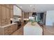 Open kitchen features wood cabinets, stainless appliances, and a large island perfect for entertaining at 559 W Davis Blvd, Tampa, FL 33606