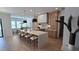 Gourmet kitchen boasts a large island, pendant lighting, and custom cabinets for a modern, functional design at 559 W Davis Blvd, Tampa, FL 33606