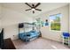 Cozy bedroom with carpet, ceiling fan, and a bunk bed; perfect for a room or guest room at 11892 Frost Aster Dr, Riverview, FL 33579