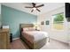 Bedroom featuring a serene accent wall and natural light at 11892 Frost Aster Dr, Riverview, FL 33579