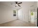 Bedroom with carpet, ceiling fan, and closet at 11892 Frost Aster Dr, Riverview, FL 33579