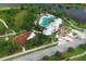 Aerial view of the community pool and recreation area, with lush landscaping and amenities for residents at 11892 Frost Aster Dr, Riverview, FL 33579