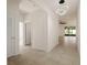Hallway with tile flooring and an ornate light fixture at 11892 Frost Aster Dr, Riverview, FL 33579